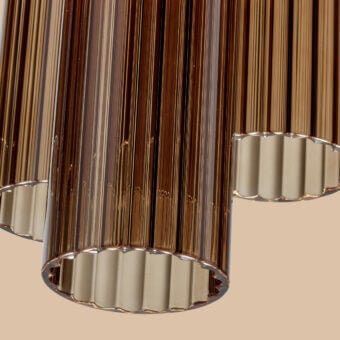 Superior Euroluce Itala suspension lamp crafted in warm amber glass with subtle ribbed detailing and light-colored metal support