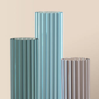 Itala table lamps by Cassoni, teal, blue-green, and gray, cylindrical shape with vertical reeding and clear glass tops.