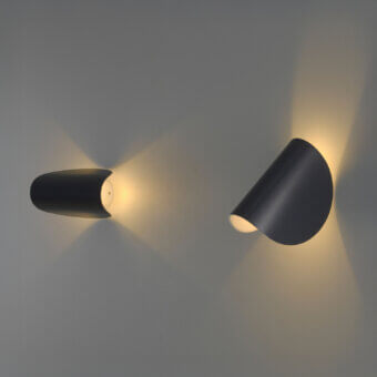 Elegant FontanaArte IO wall lamp sculpted in a curved form with painted metal and matte black finish