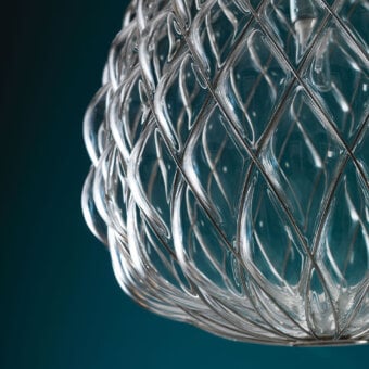 Distinguished FontanaArte Pinecone suspension lamp crafted in transparent blown glass using an ancient caged technique with glossy finish