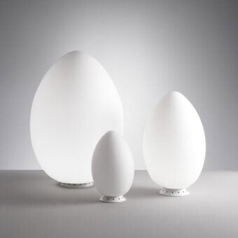 Timeless FontanaArte Uovo table lamp embodying a natural egg-like form in refined white satin blown glass with matte finish