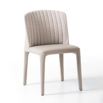 Refined Giorgetti Bicolette chair upholstered in smooth beige synthetic material with textured woven fabric and a curved silhouette