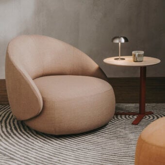 Sophisticated Lapalma Kipu Club lounge chair upholstered in a soft, matte pinkish-beige textile with an enveloping, gently embracing backrest