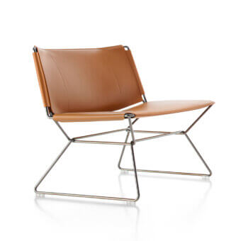 Distinguished MDF Italia Neil lounge chair in medium tan full-grain leather with a polished steel wire frame crafted with heavy-duty stitching
