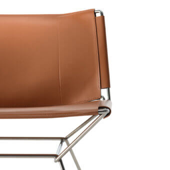 Superior MDF Italia Neil lounge chair with a steel wire frame and full-grain brown leather meticulously crafted in Italy with dyed edges