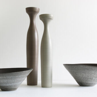 Distinguished Rina Menardi Angeli vase crafted from baked clay in a brownish-grey tone with a textured matte finish