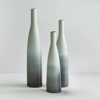 Distinguished Rina Menardi Bottiglie vase set in light gray-green baked clay with charcoal gradient and smooth matte finish