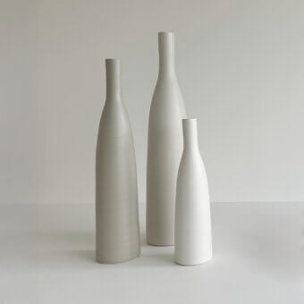 Exceptional Rina Menardi Bottiglie vase crafted in baked clay with a smooth matte surface and light gray off-white tones
