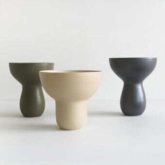 Elegant Rina Menardi Bouquet vessel crafted in baked clay with a matte finish and muted olive green hue