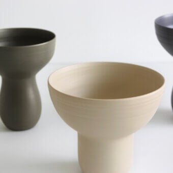 Exclusive Rina Menardi Bouquet vessel crafted in dark gray baked clay with a smooth matte finish
