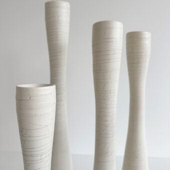 Elegant Rina Menardi Flauti vase, a handcrafted vessel in baked clay with etched lines and matte finish