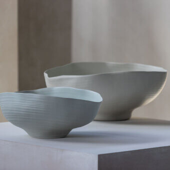 Superior Rina Menardi Fonti vessel crafted from baked clay in a grayish-blue hue with a matte finish