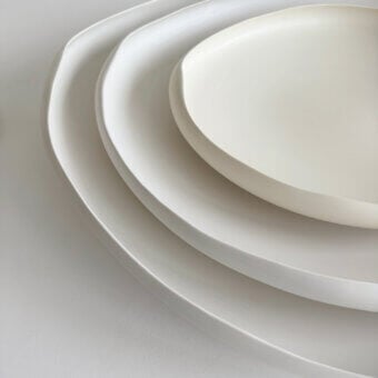Distinguished Rina Menardi Laguna centerpiece crafted in baked clay with softly curved silhouettes and matte finish