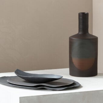 Exclusive Rina Menardi Oblo' vase sculpted from baked clay with a gradient from charcoal gray to reddish-brown and a subtly textured matte surface
