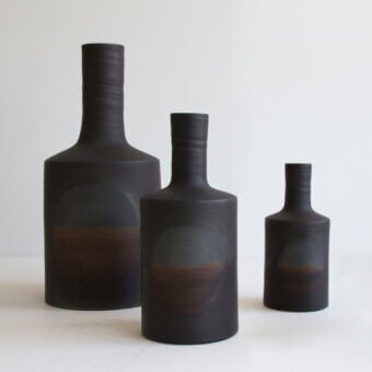 Exceptional Rina Menardi Oblo’ vase set handcrafted in baked clay with a gradient from dark to reddish-brown and a matte finish