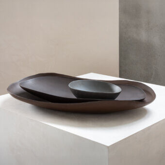 Distinguished Rina Menardi Petali centerpiece crafted in baked clay with a smooth matte finish and warm dark brown hue
