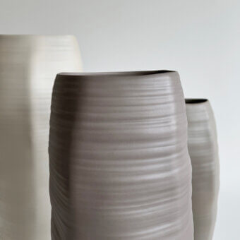 Luxury Rina Menardi Rocce vase sculpted from baked clay with a refined matte finish and subtle horizontal texture