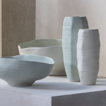 Luxury Rina Menardi Rocce vase sculpted from baked clay with a subtle ribbed texture and tonal variations in pale blue-grey