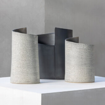 Distinguished Rina Menardi Torri vase crafted from baked clay with a light beige hue and dramatically cracked matte surface