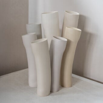 Exceptional Rina Menardi Wind vase crafted in Italy from baked clay with a smooth matte finish