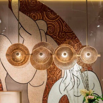 Lavish Sicis Andromeda chandelier crafted in brass with champagne finish and embellished bronzed smoky glass discs