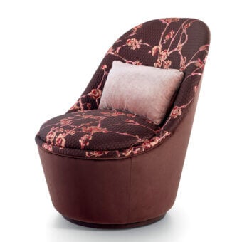 Superior Sicis Blossom lounge chair with contemporary floral textile upholstery and gently rotating coated metal base