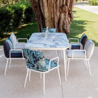 Distinguished Sicis Filicudi table with a white and gray Vetrite top and conical matte white lacquered aluminum legs