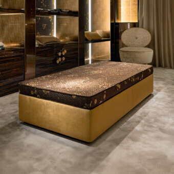 Distinguished Sicis Hector ottoman crafted with patterned textile upholstery and a smooth golden yellow base