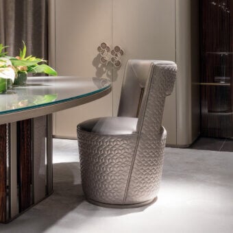 Distinguished Sicis Koro chair with enveloping polyurethane foam padding and muted gray textured coated finish accented by satin metallic banding