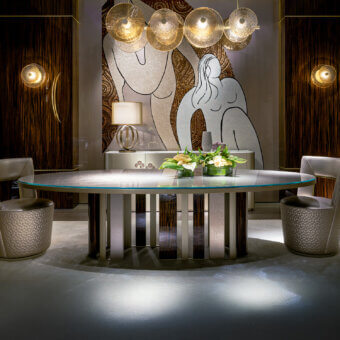 Distinctive Sicis Koro table with sleek glass top and dynamic circular metal and ebony base crafted in Italy