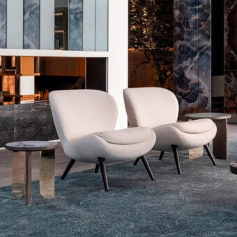Superior Sicis Niels lounge chair with textured light neutral beige textile upholstery and subtly flared dark-toned wood legs