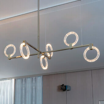 Elegant Sicis Polo suspension lamp crafted in metal with transparent methacrylate rings and brushed gold finish