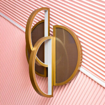 Exceptional Sicis Venus wall lamp crafted in brass with luminous backlit Vetrite glass and champagne finish