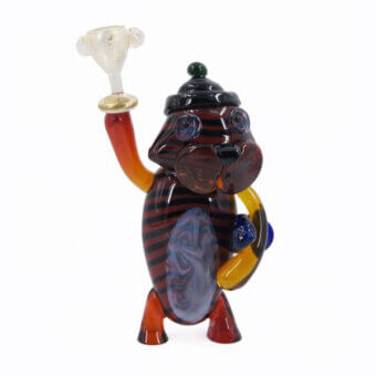 Murano glass tiger sculpture with brown and black stripes, orange legs, and a multi-colored hat holding a clear glass bowl.