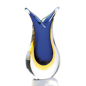Murano glass vase, clear with blue interior, asymmetrical flared shape and yellow band, sculptural design, glossy finish, white background.