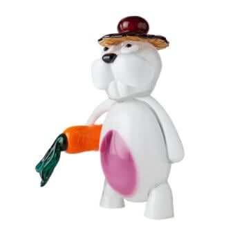 Murano glass rabbit figurine with pink belly, straw hat, and orange-green carrot, studio shot on white background.