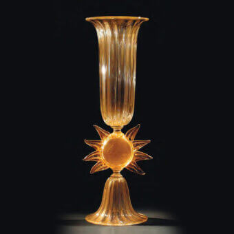 Distinguished Wave Murano Glass vase handcrafted in translucent amber glass with shimmering 24k gold leaf adornment