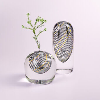 Exceptional Wave Murano Glass Spyro vase duo handcrafted in Italy with swirling black and gold filaments within crystal-clear glass