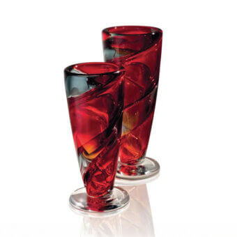 Murano glass vases, red and clear, conical shape with spiraling twist design and glossy finish, studio product shot.