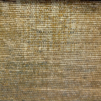 Woven textile with horizontal pattern in muted gold and charcoal, displaying a coarse texture and subtle sheen with visible yarn irregularities.
