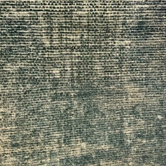 Woven textile sample, gray and beige tones, irregular mottled pattern with dense horizontal and vertical thread structure, textured surface.