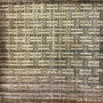 Woven textile sample, neutral beige and gray tones, irregular weave with muted gold and dark blue accents, coarse fiber texture, gold band.