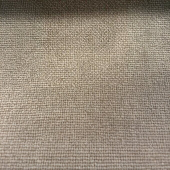 Taupe woven fabric texture with a consistent, even weave and subtle raised surface, displaying a muted warm gray tone under diffused lighting.