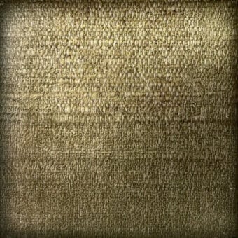 Layered texture in olive green and aged gold tones, displaying irregular marks and a granular appearance with diffused lighting.