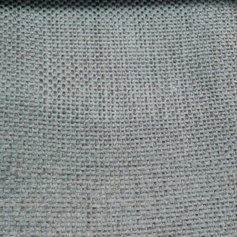 Woven textile sample, cool gray-green color, irregular grid pattern with heathered effect and visible square openings, studio shot.