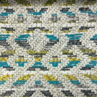 Geometric textile sample with turquoise, olive, and gray rectangular blocks woven into an off-white, nubby, and textured fabric; co1025 col.