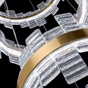 Cassoni Focus suspension lamp, clear glass rings with striated texture, brushed gold trim, concentric geometric design, diffused light.