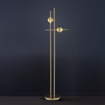 Elegant Euroluce Mikado floor lamp crafted in metal with warm gold satin finish and delicate spherical glass shades