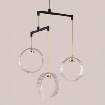 Elegant Euroluce Sospeso suspension lamp in clear glass and dark-toned steel with a matte black metal frame and gold-toned wire accents
