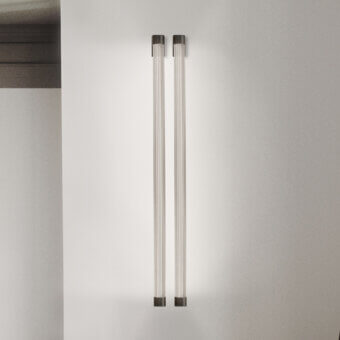 Captivating Euroluce Trama wall lamp crafted in borosilicate glass with a dark matte metal frame emitting a diffused Neonflex glow